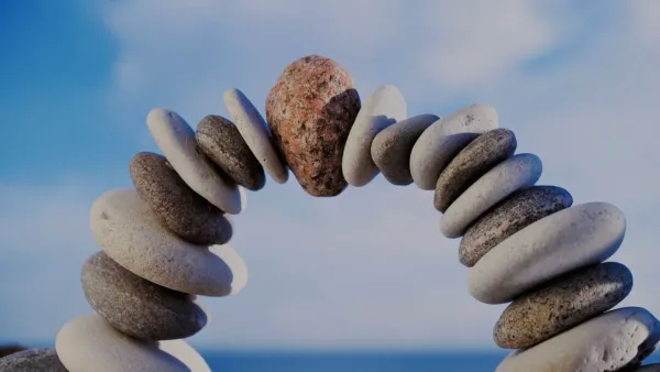 An arch of stacked stones on a beach